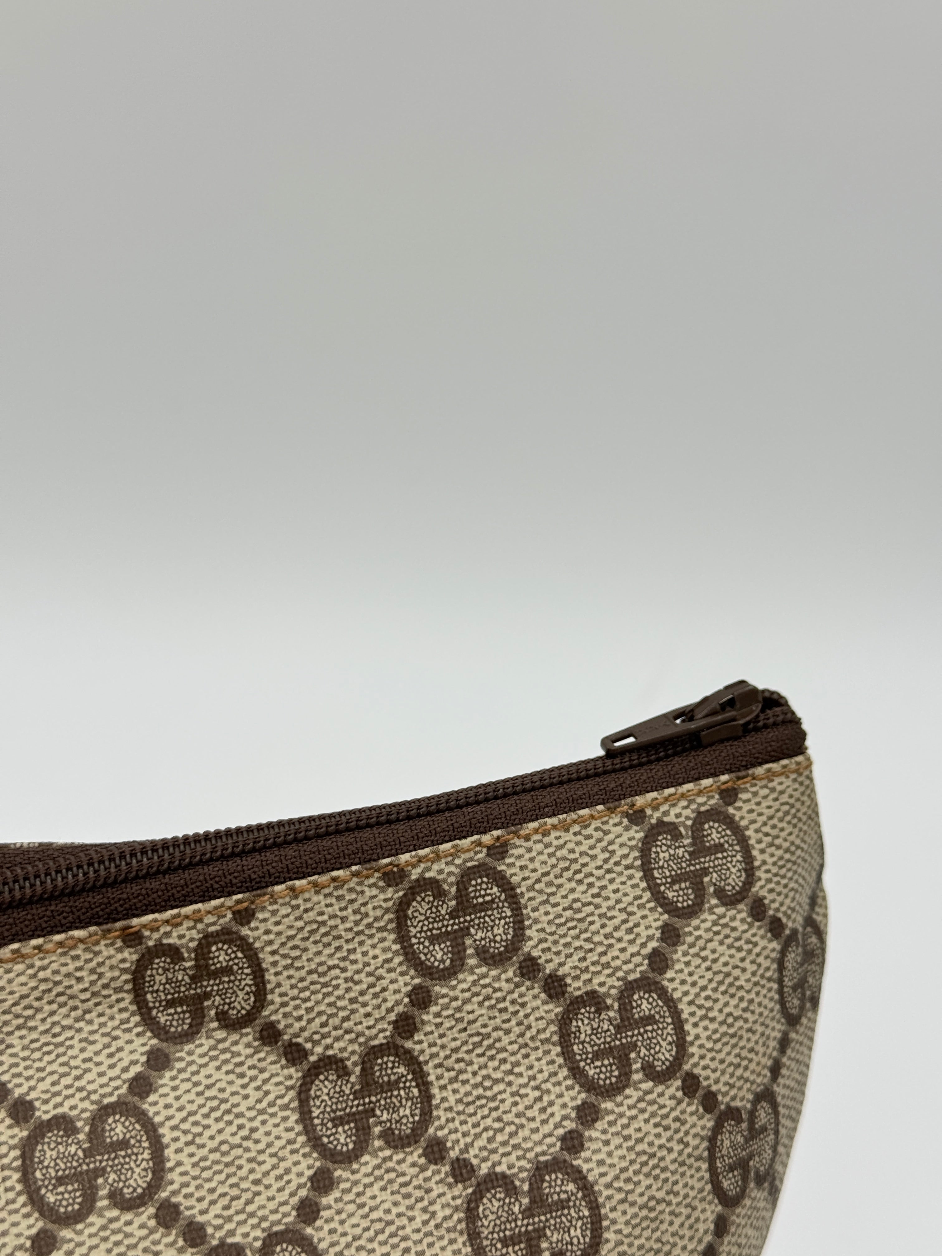 Gucci Supreme Clutch