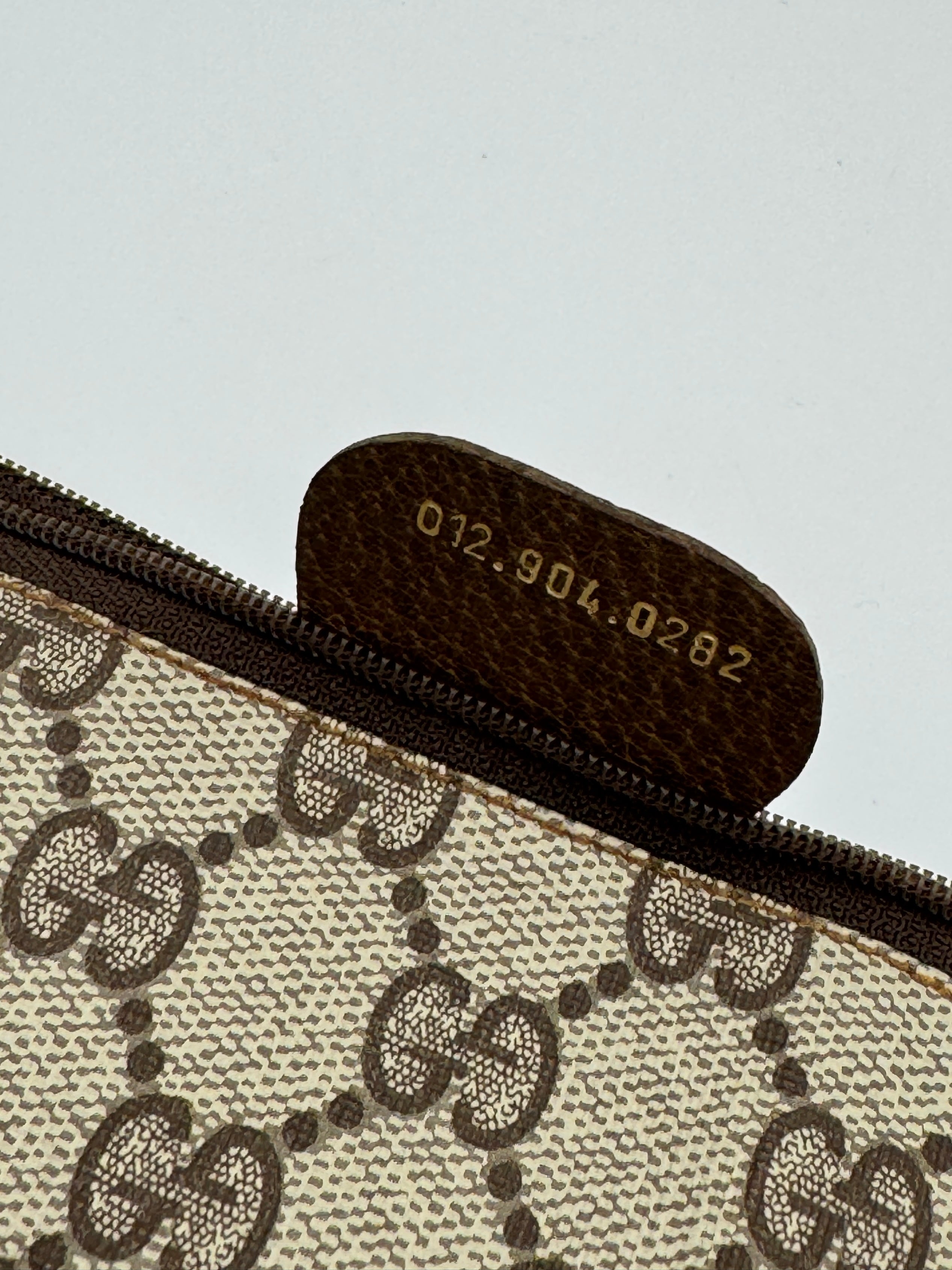 Gucci Supreme Clutch
