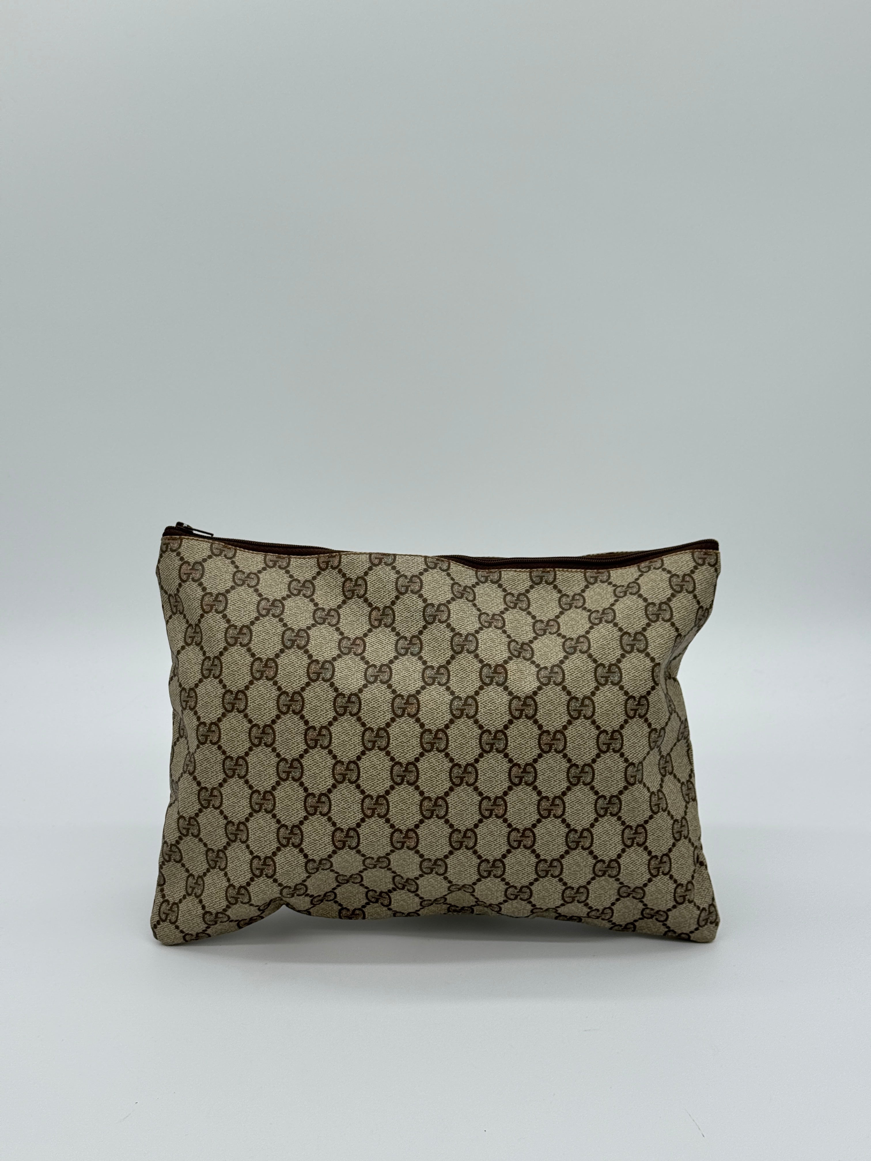 Gucci Supreme Clutch